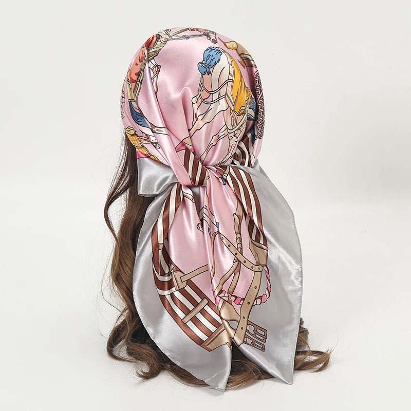 Elegant satin square scarf featuring a floral design in pink and gold tones