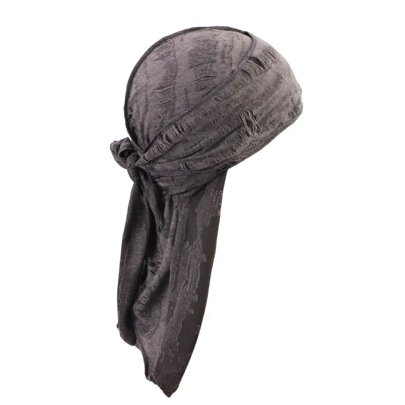A dark gray distressed pirate style durag head wrap folded and draped.