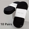 A stack of ten pairs of black invisible silicone no-show boat socks with white labels.
