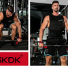 A muscular man performing a weightlifting exercise using heavy-duty wrist straps in a gym setting.