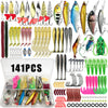 A variety of fishing lures including spoons, spinners, plugs, and jigs are displayed in an open box.