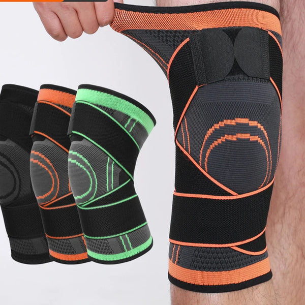 A hand holds a black elastic knee pad with orange and neon green accents, showing the side view of the product.