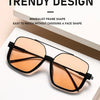 A pair of trendy orange-tinted sunglasses with black frames displayed on a white background.