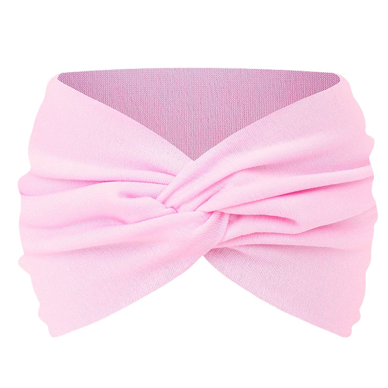 Pink twisted criss cross elastic headband for yoga and sports