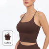 A model wearing a brown summer strappy yoga sports bra with built-in padding.