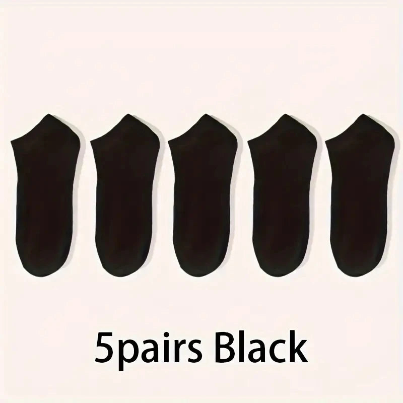 Five pairs of black comfort fit ankle socks laid out in a row.