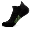 Black performance compression sports socks with neon green stripes on the foot