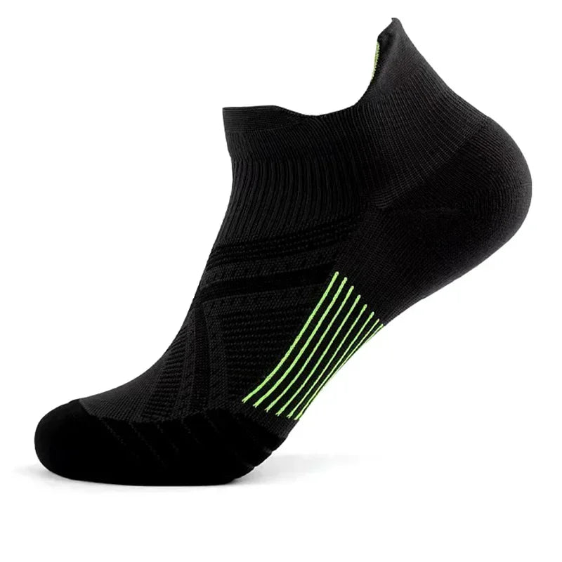 Black performance compression sports socks with neon green stripes on the foot