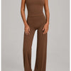 A woman wearing a mocha brown high-waist yoga and fitness tracksuit set.