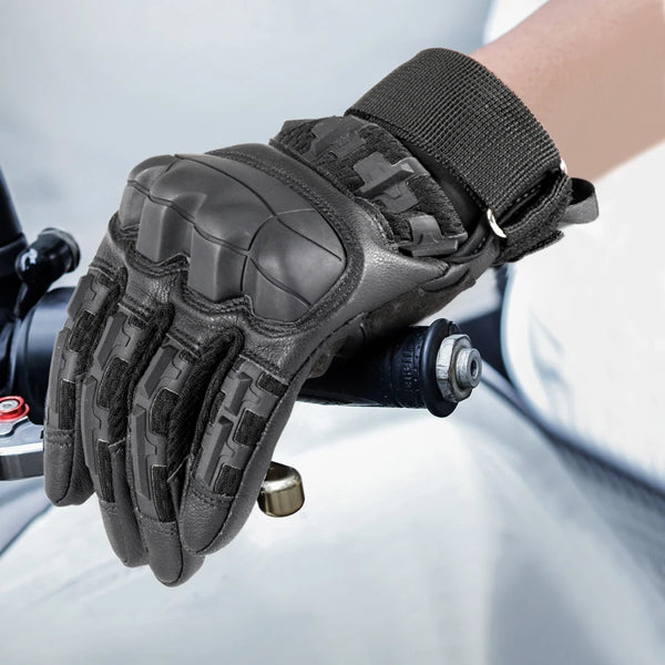 A close-up of black tactical outdoor gloves worn on a hand, showing the textured grip and wrist cuff.