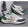 A white and green men's breathable mesh running shoe with purple accents shown from the side.
