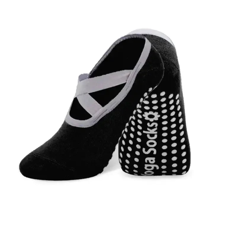 Black silicone anti-slip pilates and yoga socks with a white strap detail