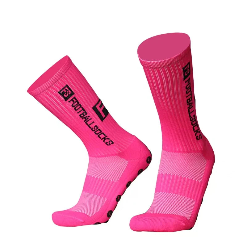 A pair of bright pink anti-slip silicone grip football socks shown in a vertical display.