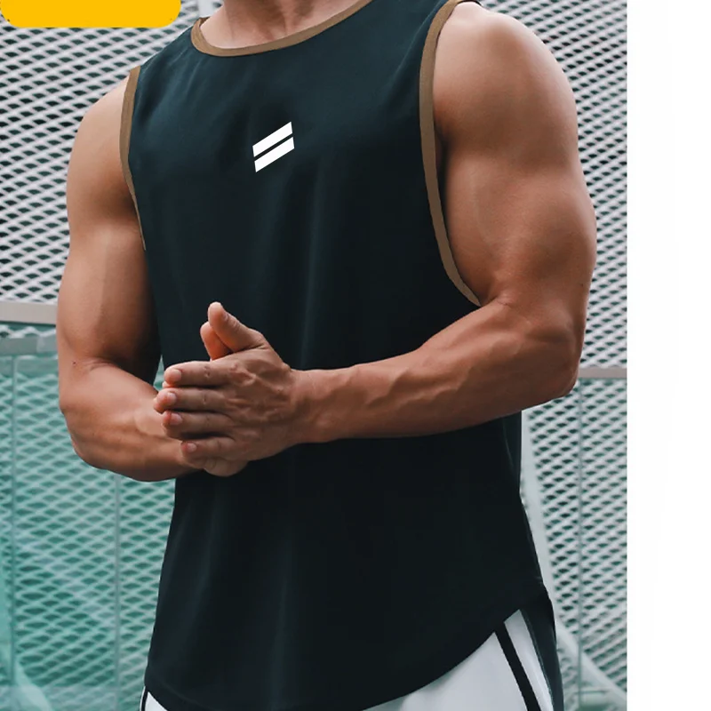 A muscular man wearing a black sleeveless sports tank top with white stripes, posing outdoors.