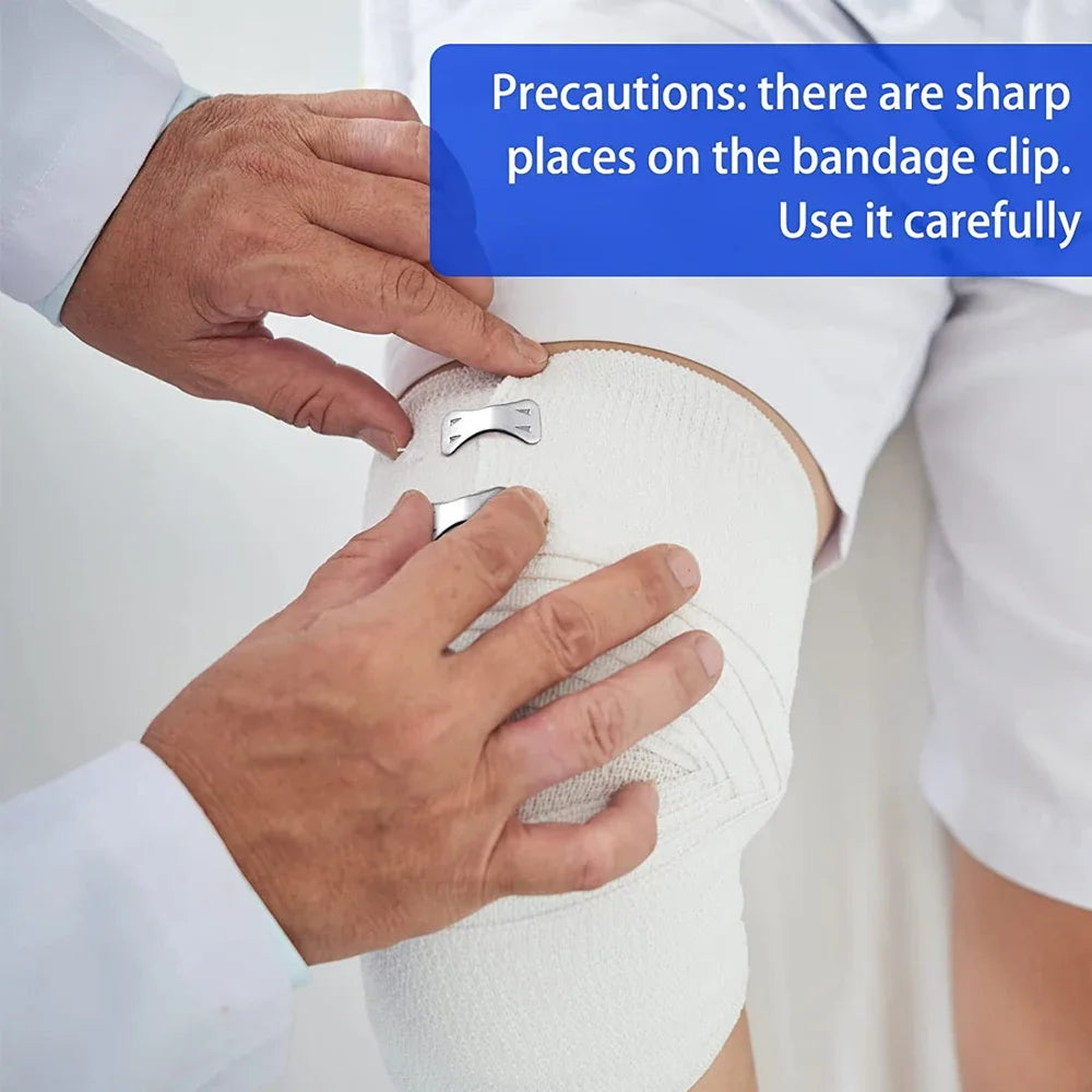 Hands are carefully using a bandage clip on a white elastic compression bandage for sports and first aid.