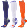 Three pairs of medical grade compression socks in navy blue, white, and orange showing different levels of compression.