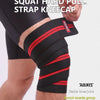 Black and red strap kneecap wraps applied to a person's knee during a workout.