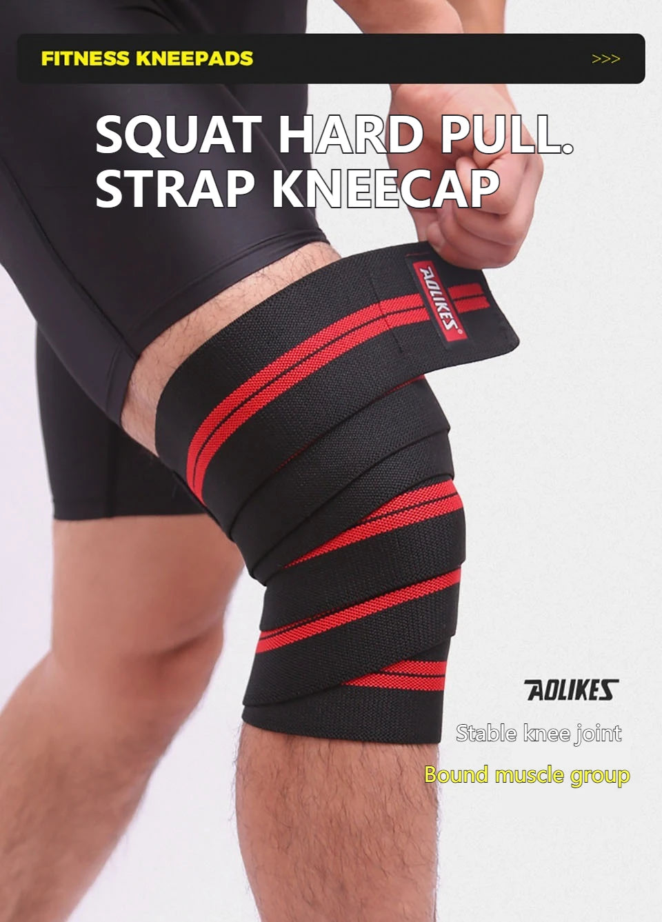 Black and red strap kneecap wraps applied to a person's knee during a workout.