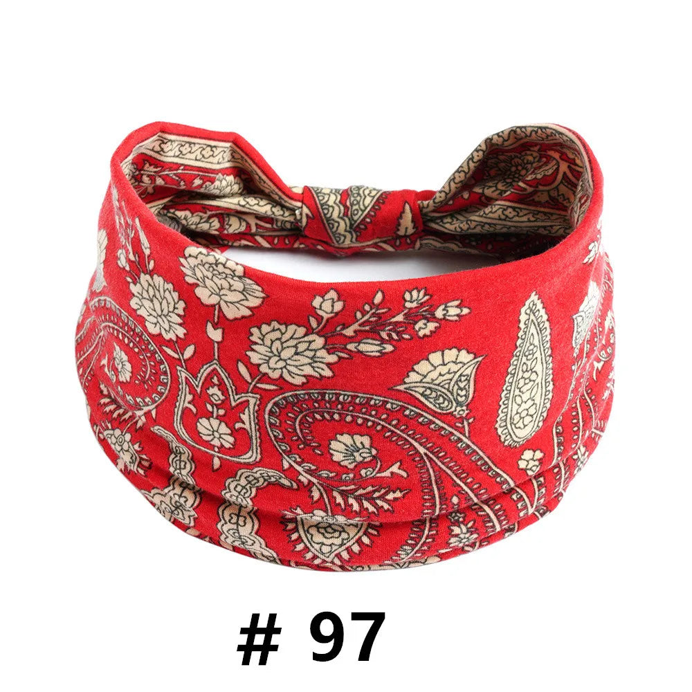 Red cotton headband with a paisley print featuring beige floral designs