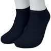 A pair of navy blue bamboo fibre anti-odor socks shown on a person's foot.