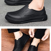 Black men's anti-slip oil-resistant kitchen clogs shown from the side and top view.