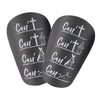 Un par de espinilleras de fútbol mini negras con el texto "Can't Can't Can't Can't Can't"