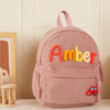 Rosa Samt-Rucksack mit dem Namen Amber aufgestickt