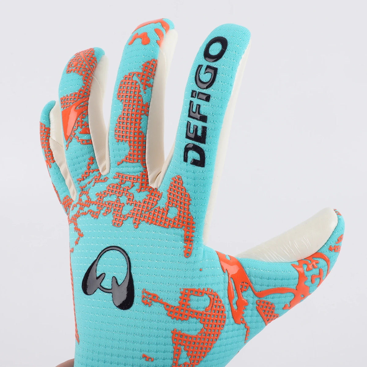 A pair of bright turquoise goalkeeper gloves with orange accents and the word DEFIGO visible on the back.