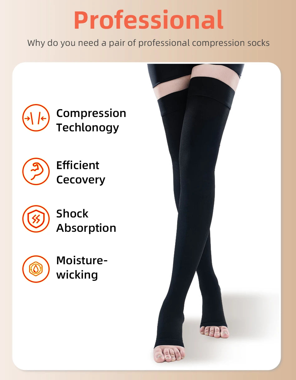A pair of black professional compression socks being worn on a person's lower leg.