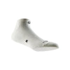A white performance ankle sock is shown from the side, highlighting its textured knit and fit.