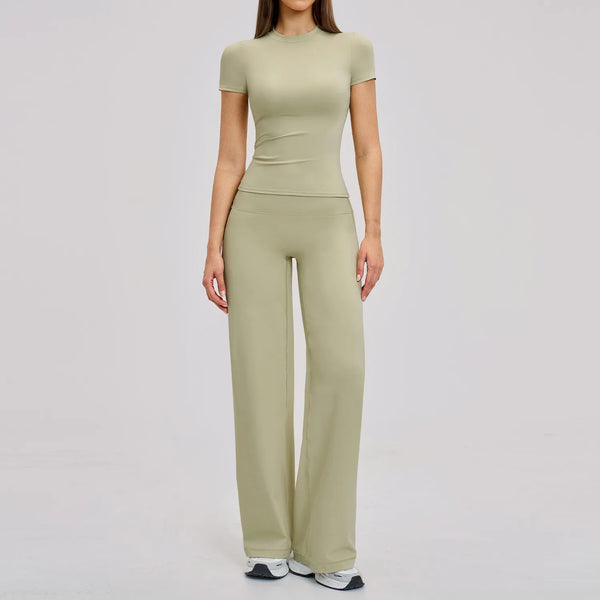 A woman wearing a matching olive green high-waist yoga and gym leggings set.