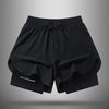 Black men's quick-dry 2-in-1 athletic shorts laid flat against a gray background.