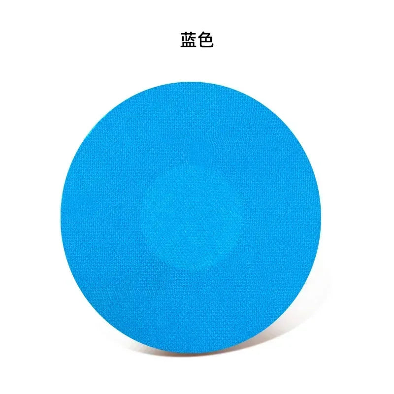 A circular blue adhesive patch used for sensor fixing.