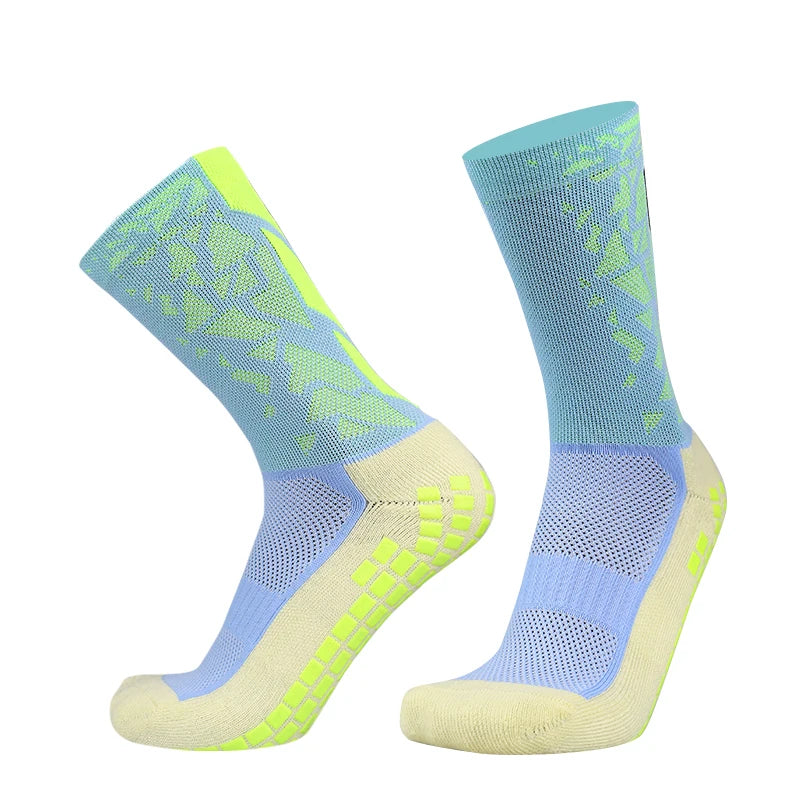 A pair of light blue and neon yellow anti-slip silicone football socks shown from the side.