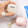 A hand holds a clear silicone protective case for AirPods Pro, featuring a leopard print design.