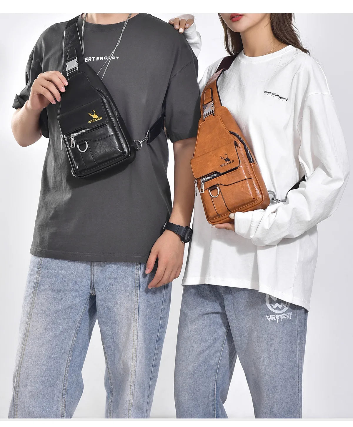 A man wearing a dark t-shirt holds a black leather crossbody bag.