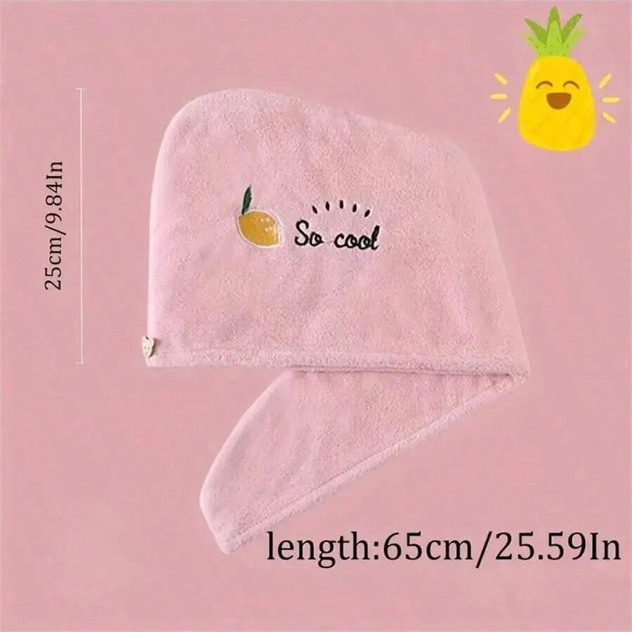 Rosa Stick-Haube zum Trocknen mit Zitronendesign und dem Text "So cool" auf hellem Rosa Hintergrund.