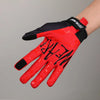 A close-up of a red cycling riding glove with black accents and white lettering on the palm.