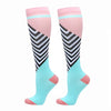 Pair of pink and light blue compression elastic socks with black stripes.