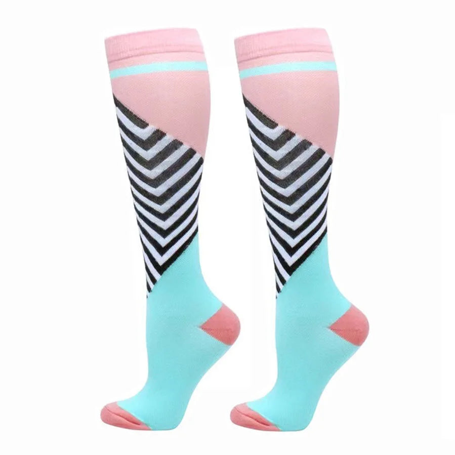 Pair of pink and light blue compression elastic socks with black stripes.
