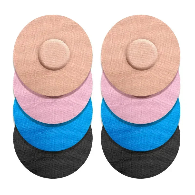 A set of reusable adhesive patches in various pastel and dark colors, arranged in a stack.