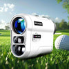 A white REVASRI laser rangefinder device resting on green grass with a golf ball nearby.
