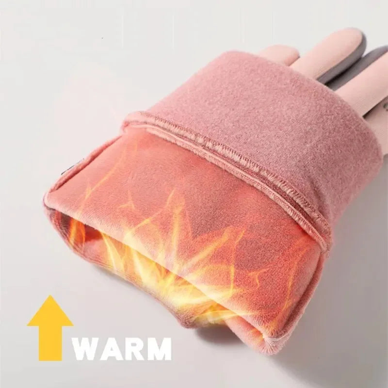 A pair of pink thermal cycling and running gloves showing a warm orange glow on the palm side.