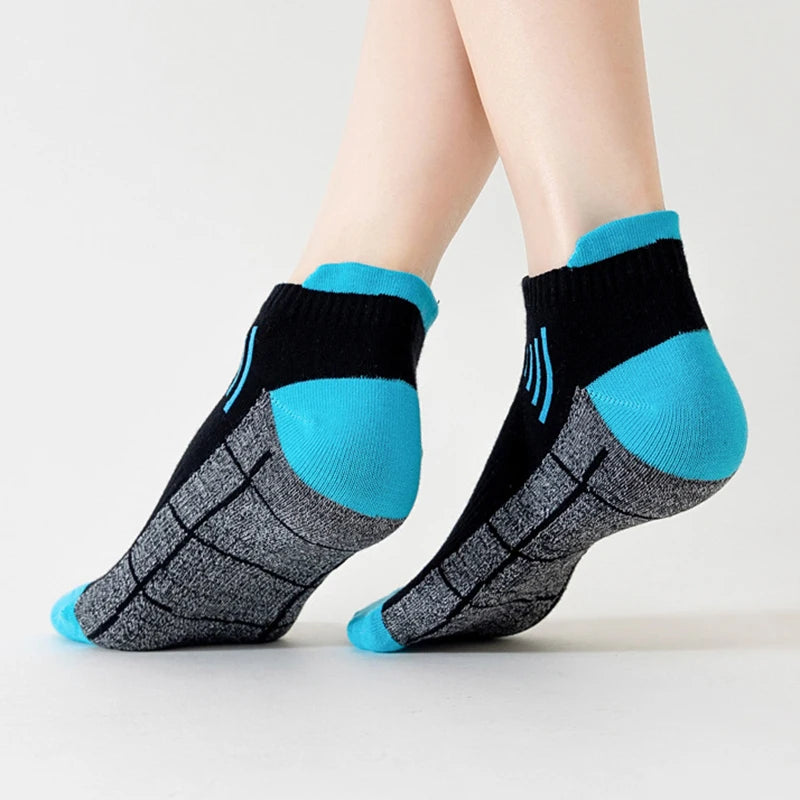 A pair of premium breathable knit sports socks featuring black and bright blue accents.