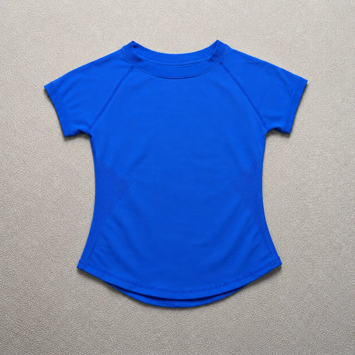A bright royal blue seamless high-waist yoga top for women.