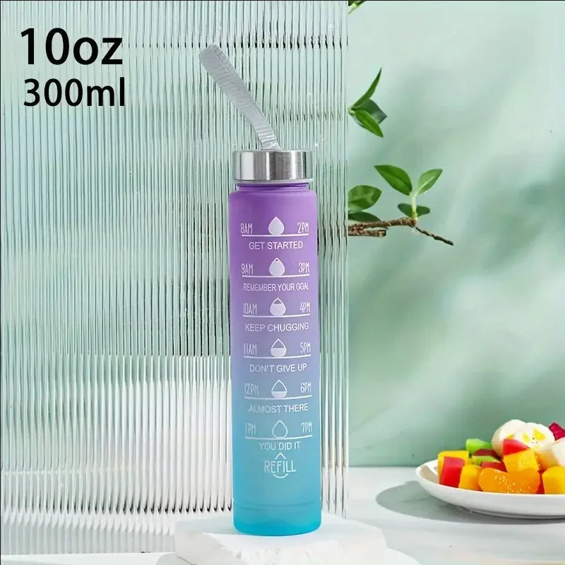 A tall, light blue water bottle with a silver straw and purple liquid is shown against a vertical ribbed background.