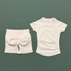 A white seamless yoga set for women featuring a short sleeve top and workout leggings.