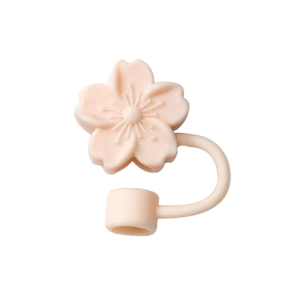 A light pink silicone butterfly straw cover for tumblers.