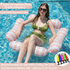 A woman relaxing on a pink and white corrugated float in water.