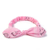 Pink boho paisley elastic hair headbands tied in a bow